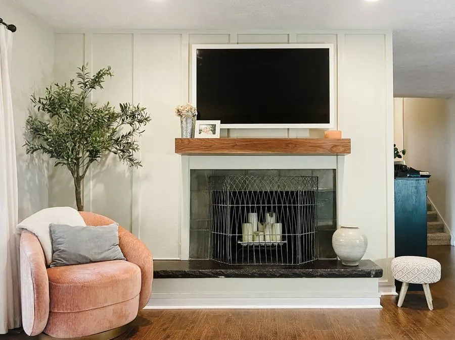 A floating mantel installed above a fireplace in a styled living room. Photo from ultrashelf.com.